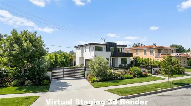 a front view of a house with a yard and potted plants