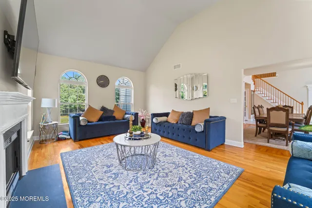 a kitchen with stainless steel appliances granite countertop a refrigerator sink stove microwave and cabinets