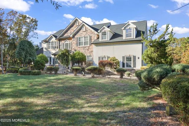 a view of a brick building with a bench in front of building
