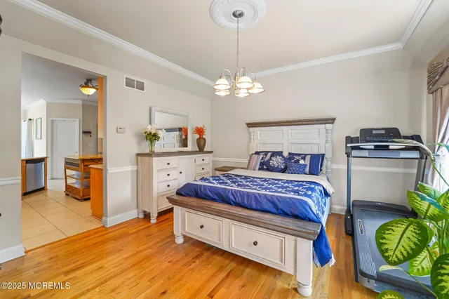 a spacious bathroom with a granite countertop sink mirror and a bathtub