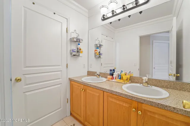 a spacious bedroom with a bed and wooden floor