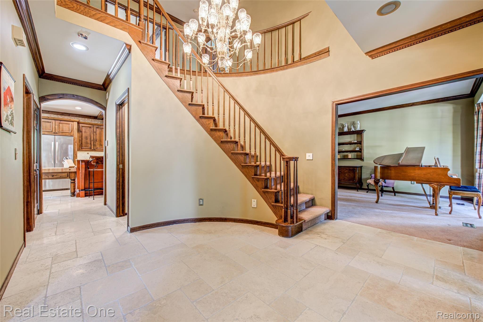 3274 Quail Ridge Circle Rochester, MI 48309 - Photo 11 of 74 Two story foyer with curved staircase and Travertine limestone floors