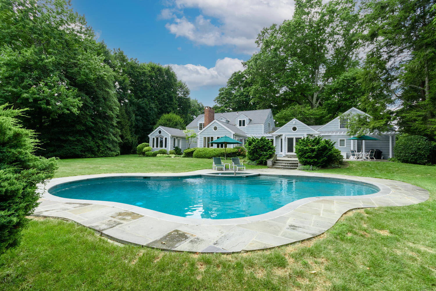 10 Highview Road Darien, CT 06820 - Photo 34 of 42 a view of a swimming pool with a yard
