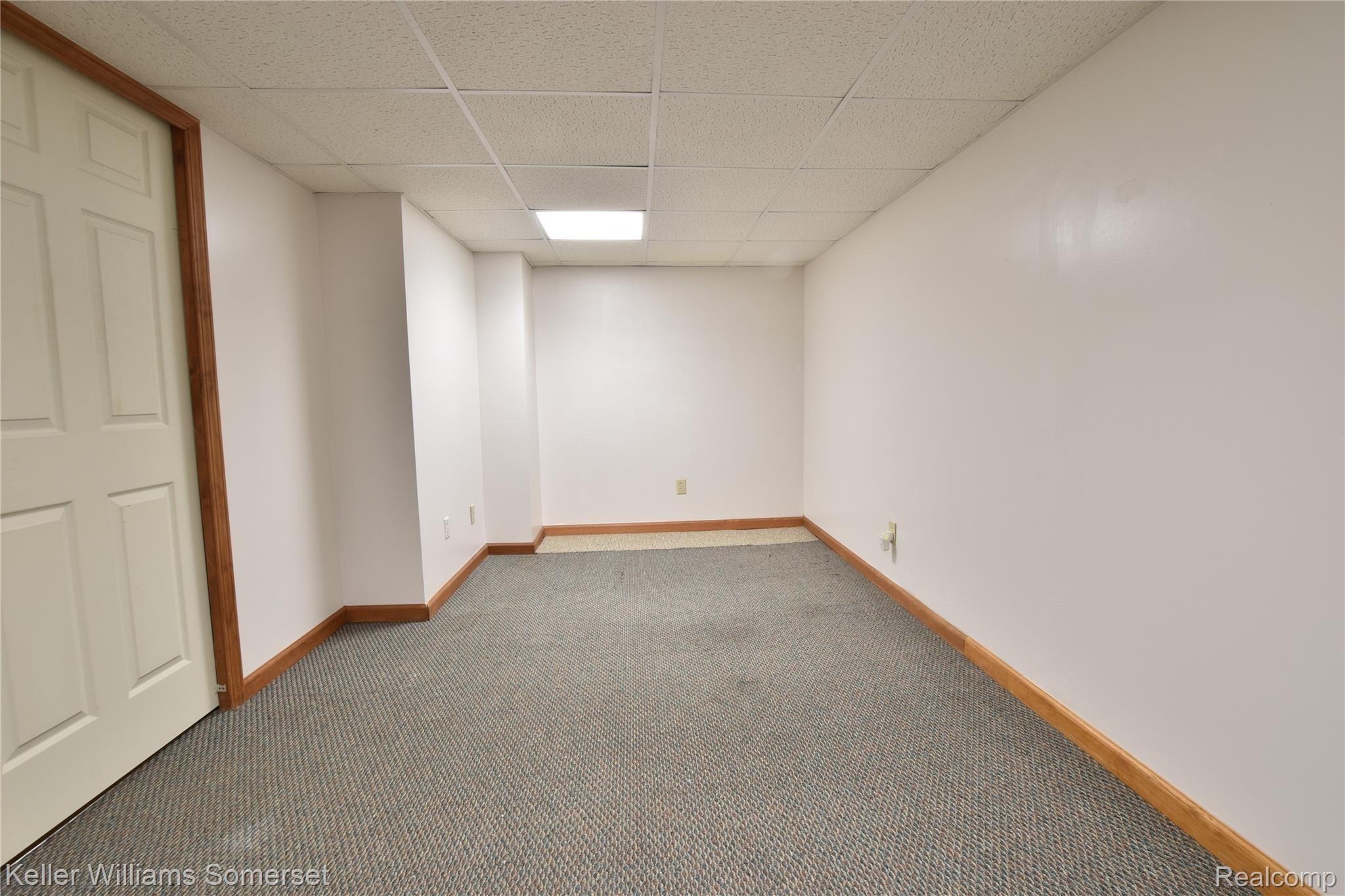 5075 Crooks Road, Unit 12 Royal Oak, MI 48073 - Photo 17 of 22 Freshly painted finished basement