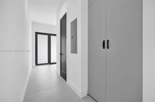 a view of a hallway with closet