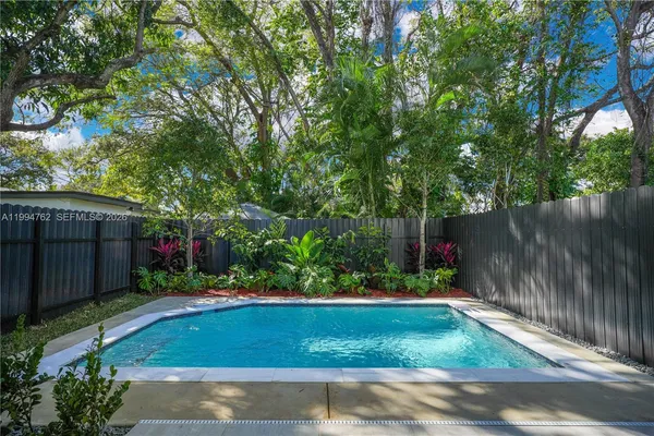 a view of a backyard with a patio
