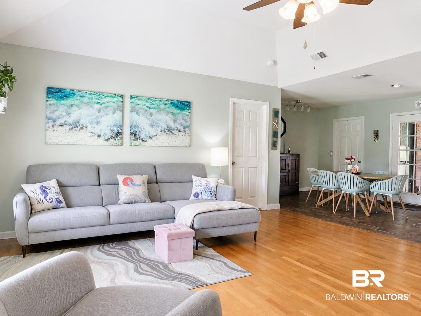 21733 Sedlack Road Silverhill, AL 36576 - Photo 9 of 22 Bright living area featuring wood-finish flooring, a vaulted ceiling, and an open concept layout