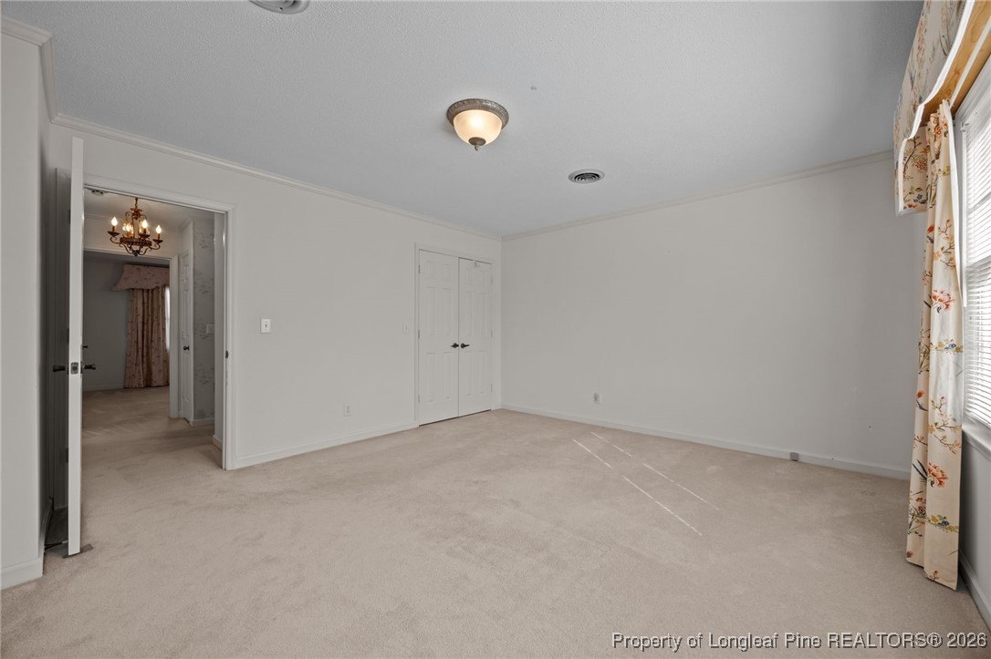 4943 Highway 301 Benson, NC 27504 - Photo 12 of 49 an empty room with windows and closet