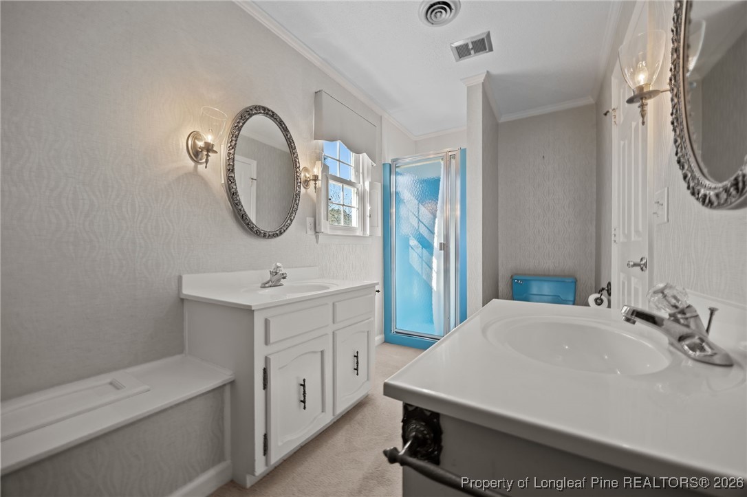 4943 Highway 301 Benson, NC 27504 - Photo 14 of 49 a bathroom with a sink and a mirror