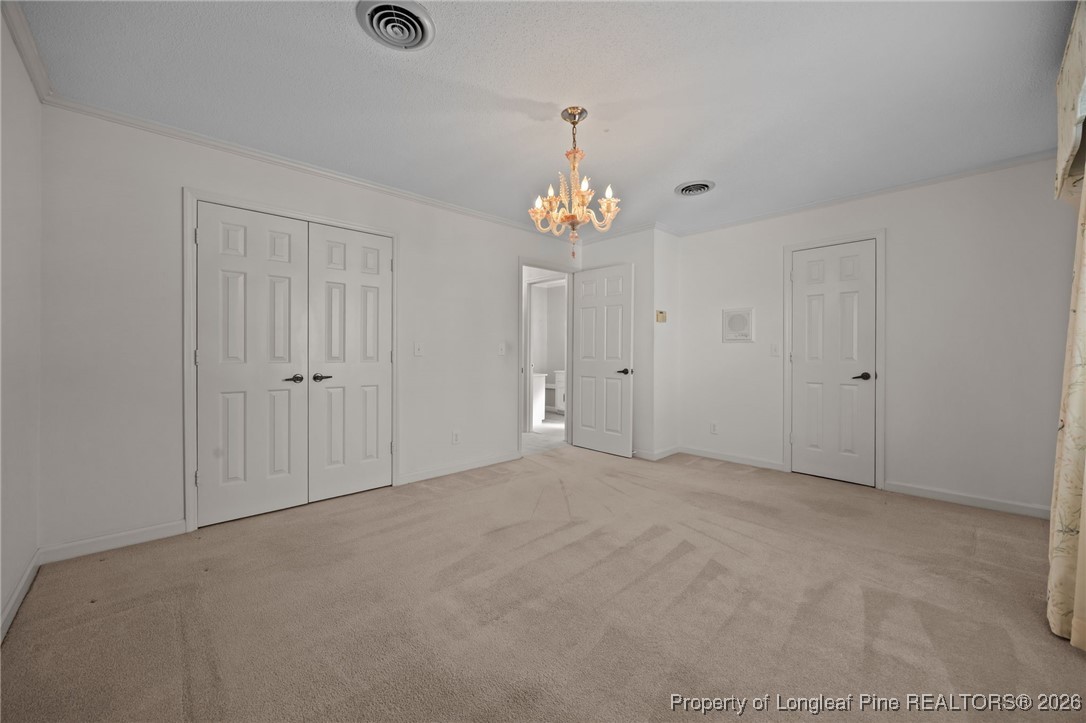 4943 Highway 301 Benson, NC 27504 - Photo 16 of 49 a view of an empty room with chandelier