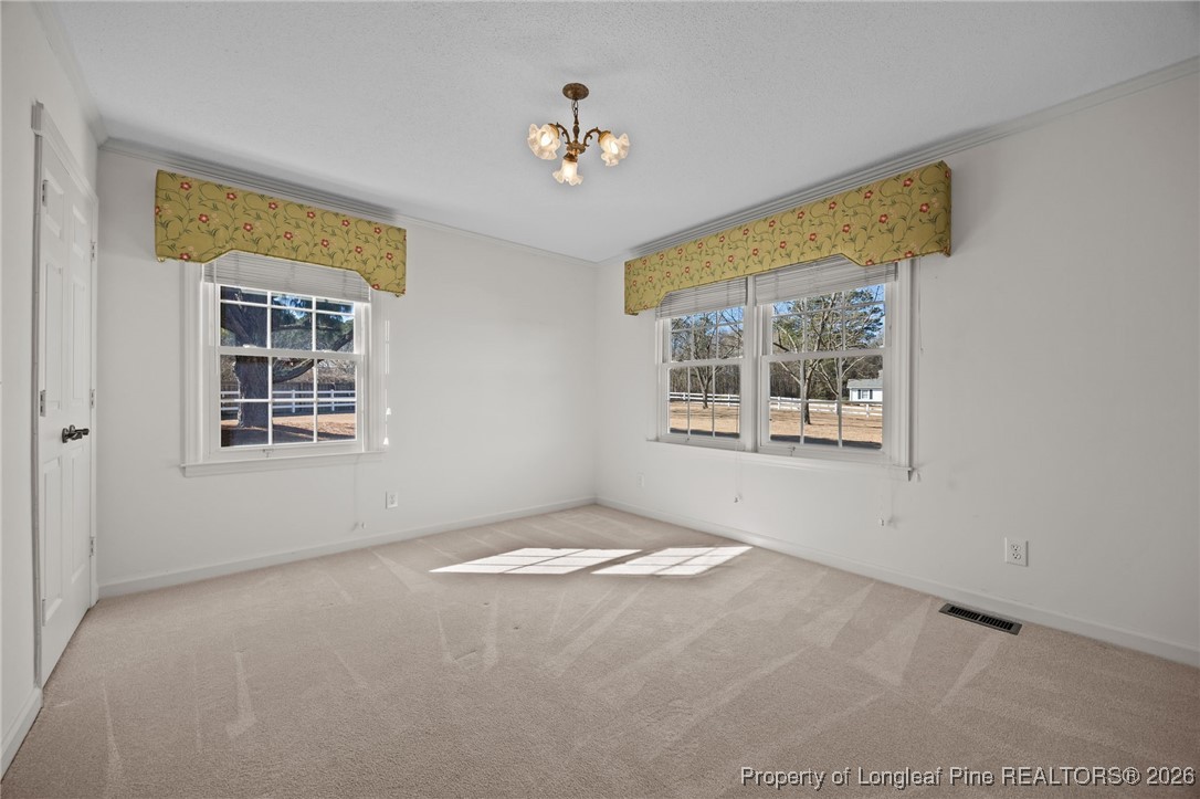 4943 Highway 301 Benson, NC 27504 - Photo 19 of 49 a view of an empty room with a window