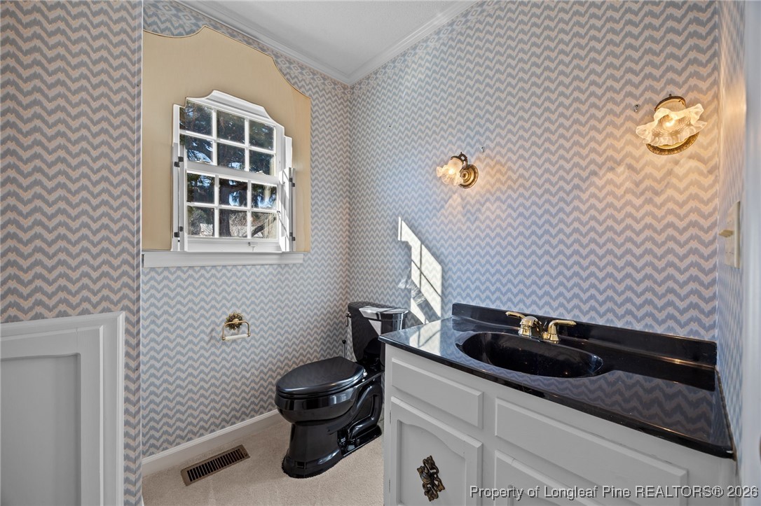 4943 Highway 301 Benson, NC 27504 - Photo 20 of 49 a bathroom with a sink and mirror