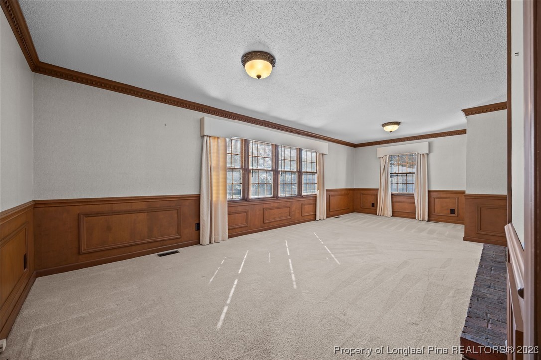 4943 Highway 301 Benson, NC 27504 - Photo 22 of 49 a bedroom with a bed and a large window