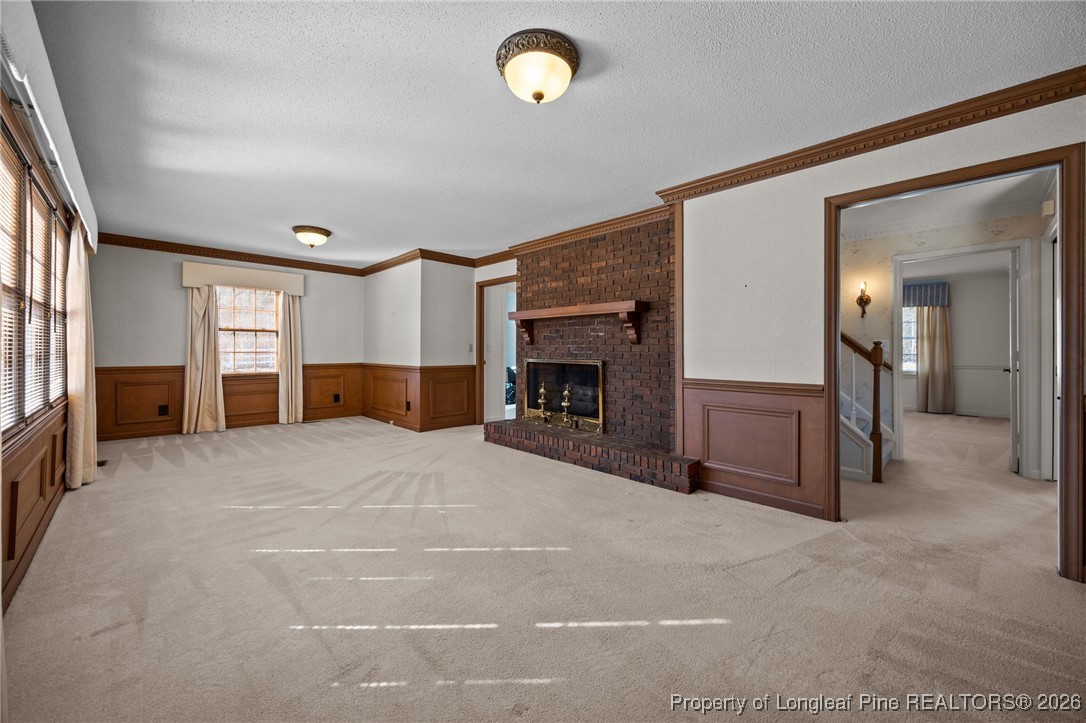 4943 Highway 301 Benson, NC 27504 - Photo 23 of 49 a big room with fireplace and a window