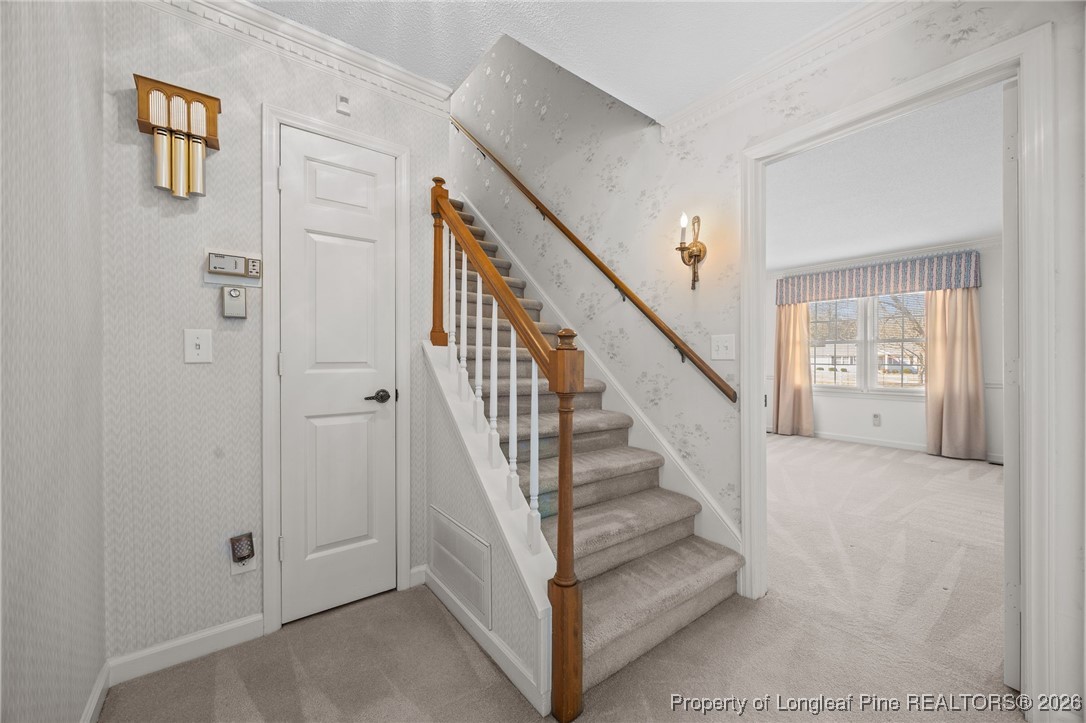 4943 Highway 301 Benson, NC 27504 - Photo 27 of 49 a view of a hallway with staircase