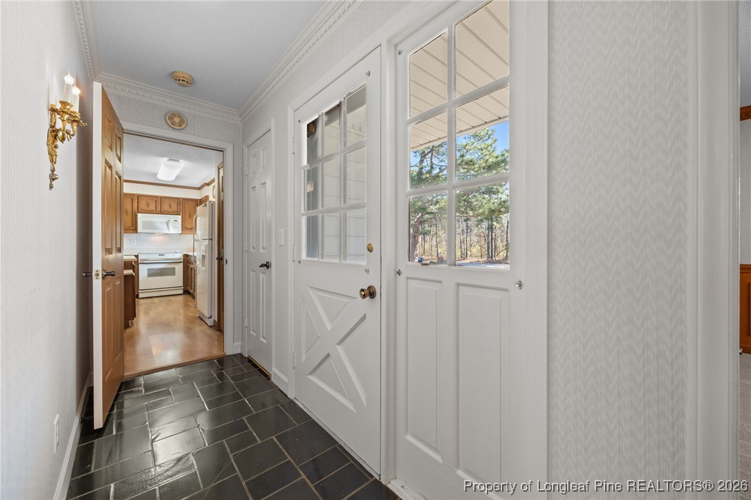 4943 Highway 301 Benson, NC 27504 - Photo 29 of 49 a view of a hallway with wooden floor and windows