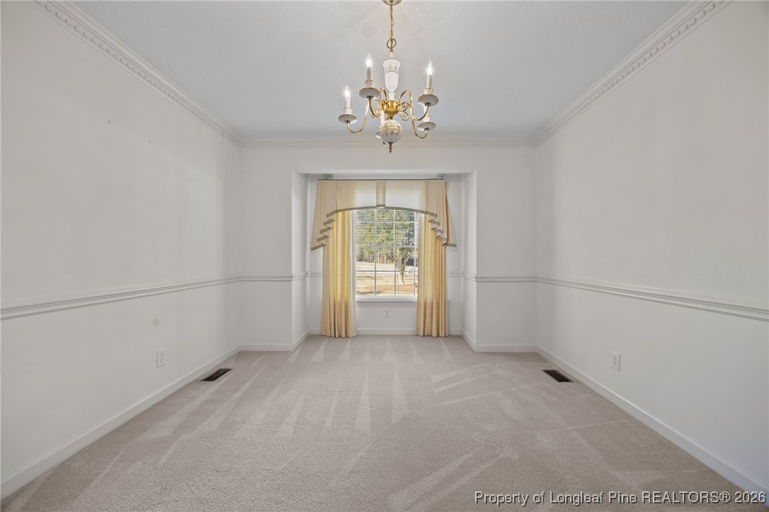 4943 Highway 301 Benson, NC 27504 - Photo 31 of 49 a view of an empty room with a window