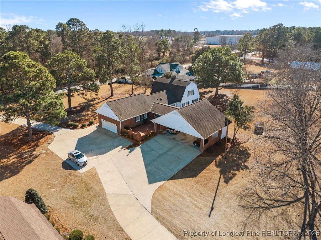 4943 Highway 301 Benson, NC 27504 - Photo 39 of 49 an aerial view of a house with a yard and mountain view in back