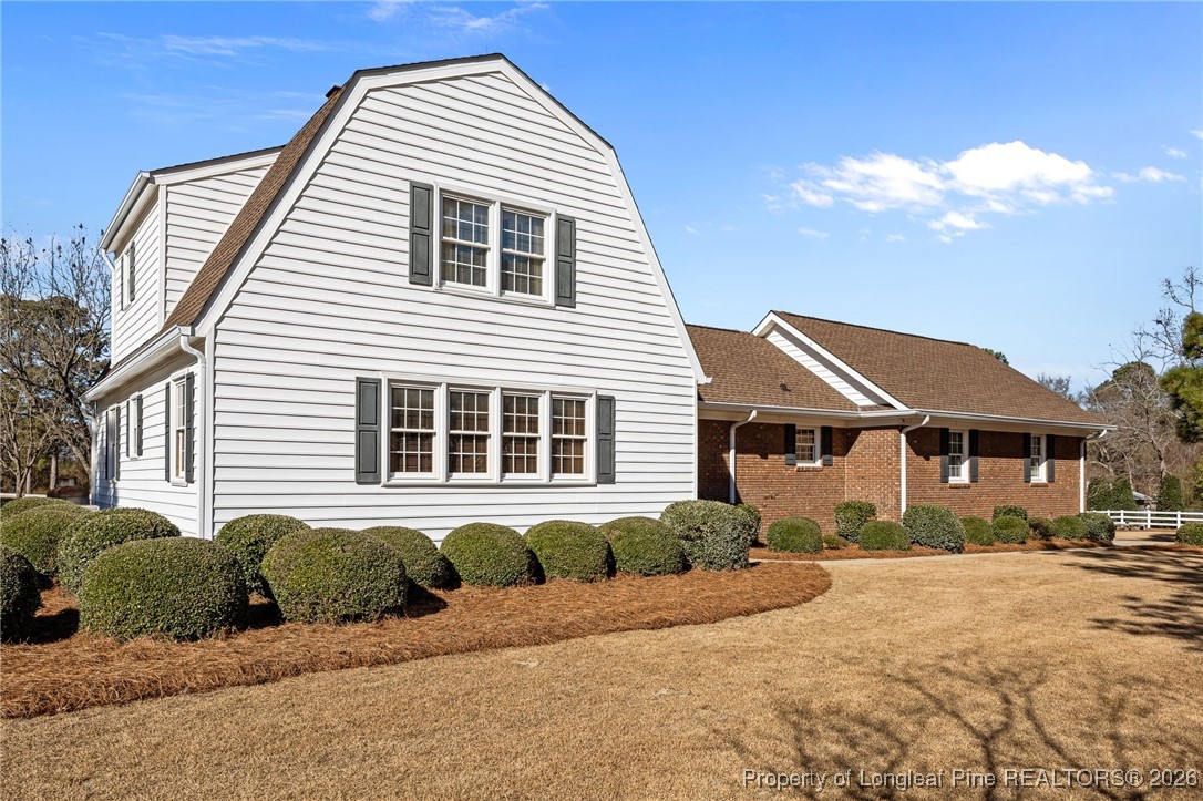 4943 Highway 301 Benson, NC 27504 - Photo 4 of 49 a front view of a house with a yard