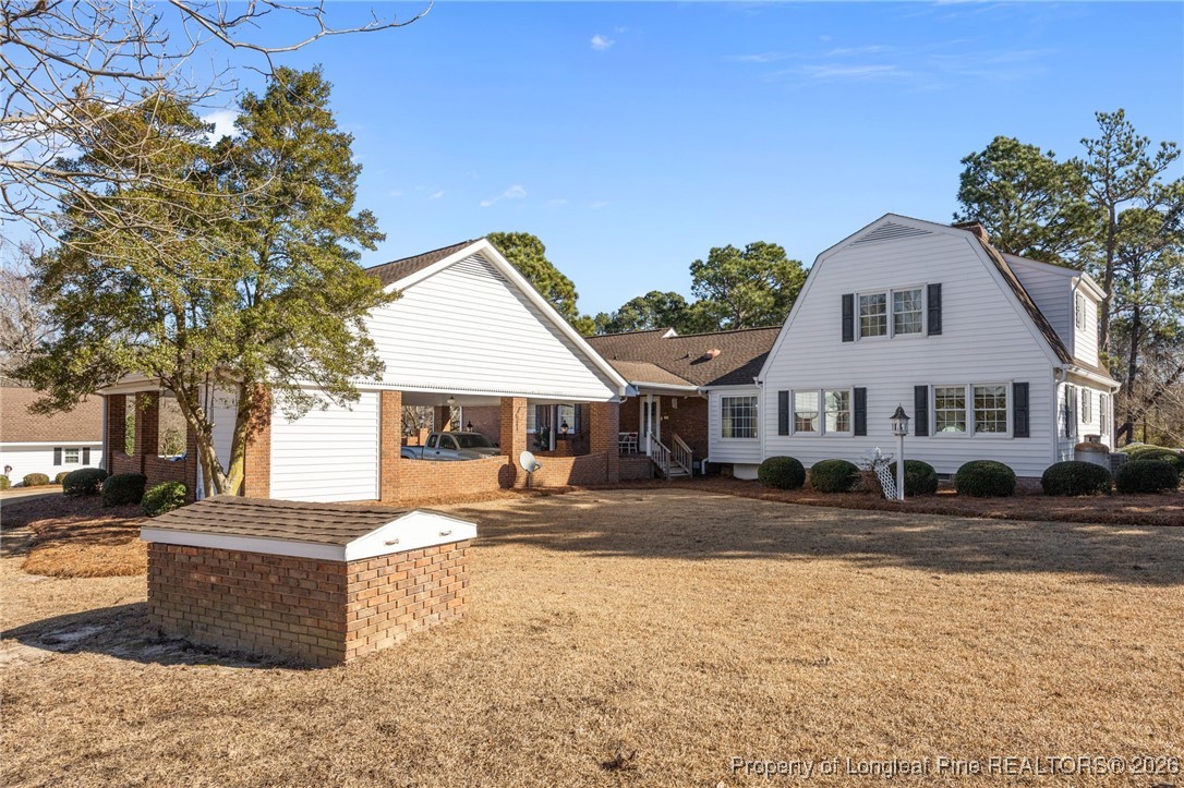 4943 Highway 301 Benson, NC 27504 - Photo 48 of 49 a front view of a house with a yard
