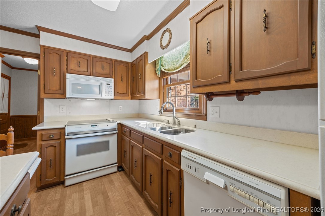 4943 Highway 301 Benson, NC 27504 - Photo 9 of 49 a kitchen with stainless steel appliances granite countertop a sink and a stove