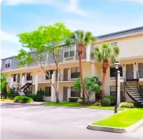 a front view of house with yard and green space