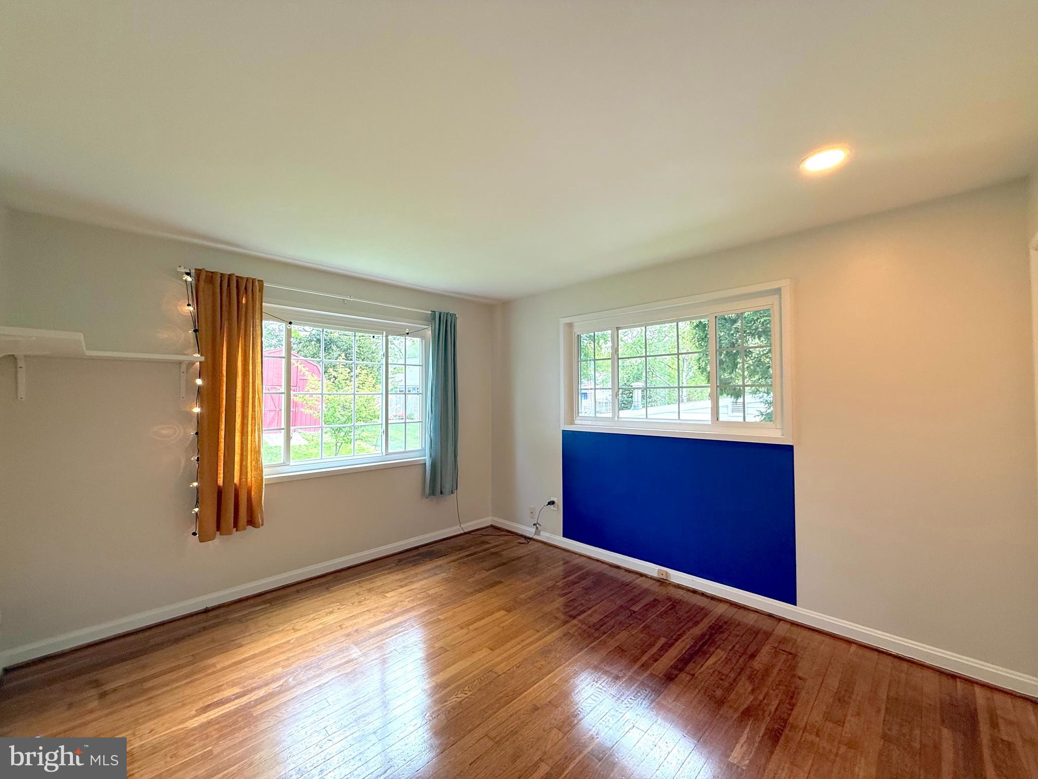 3514 May Street Silver Spring, MD 20906 - Photo 12 of 33 a view of an empty room with wooden floor and a window