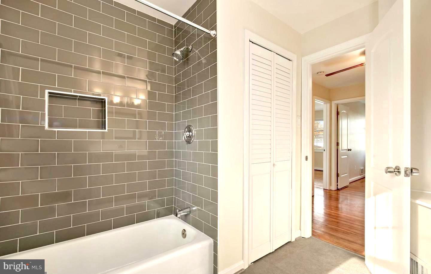 3514 May Street Silver Spring, MD 20906 - Photo 15 of 33 a bathroom with a bathtub and a shower