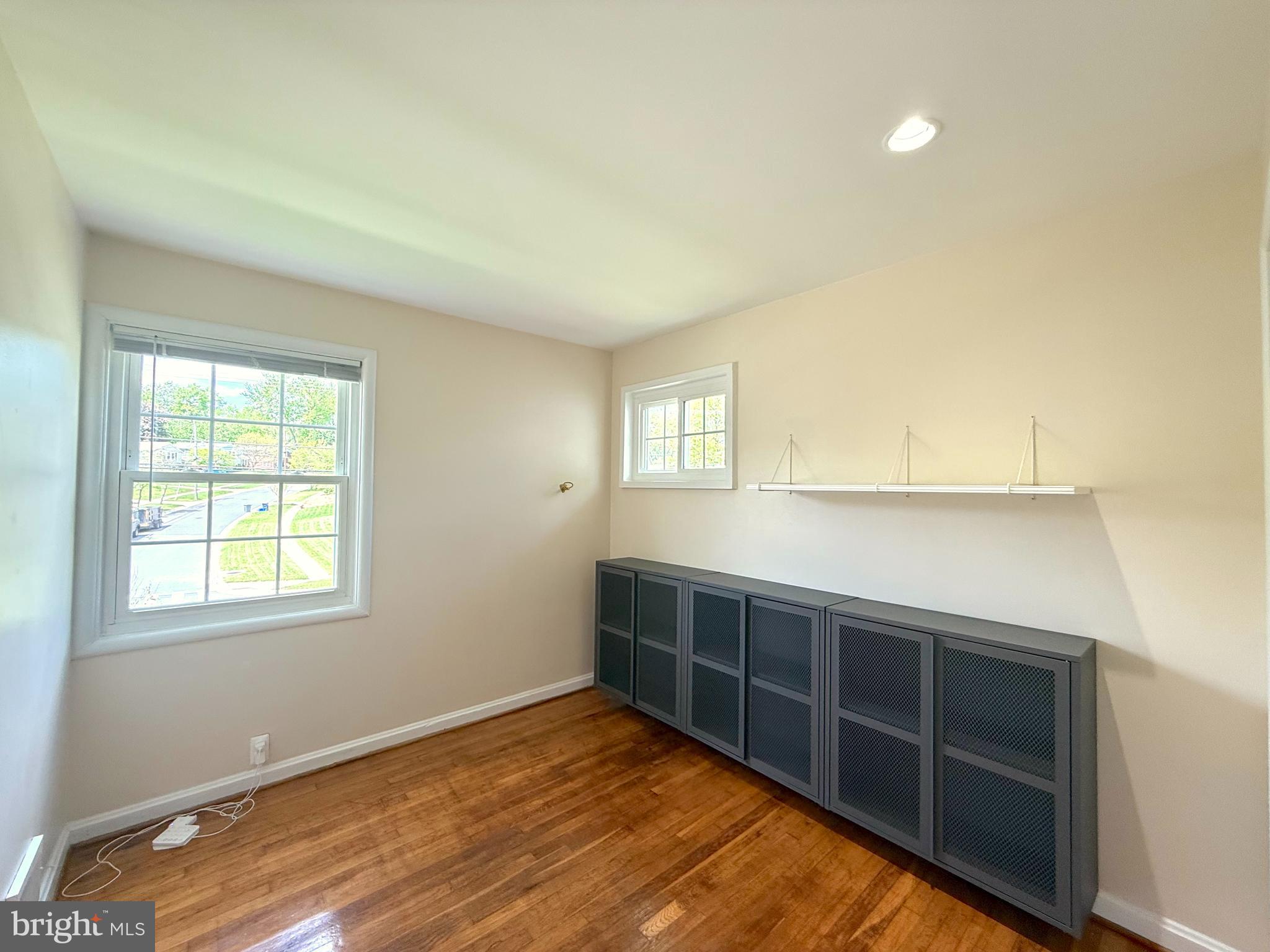 3514 May Street Silver Spring, MD 20906 - Photo 16 of 33 a view of an empty room with wooden floor and a window
