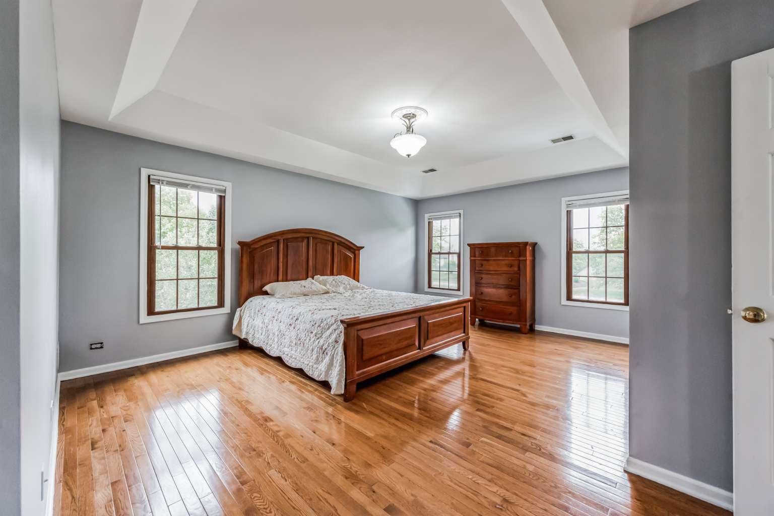 1113 Stonegate Court Bartlett, IL 60103 - Photo 12 of 25 a bedroom with a bed and wooden floor
