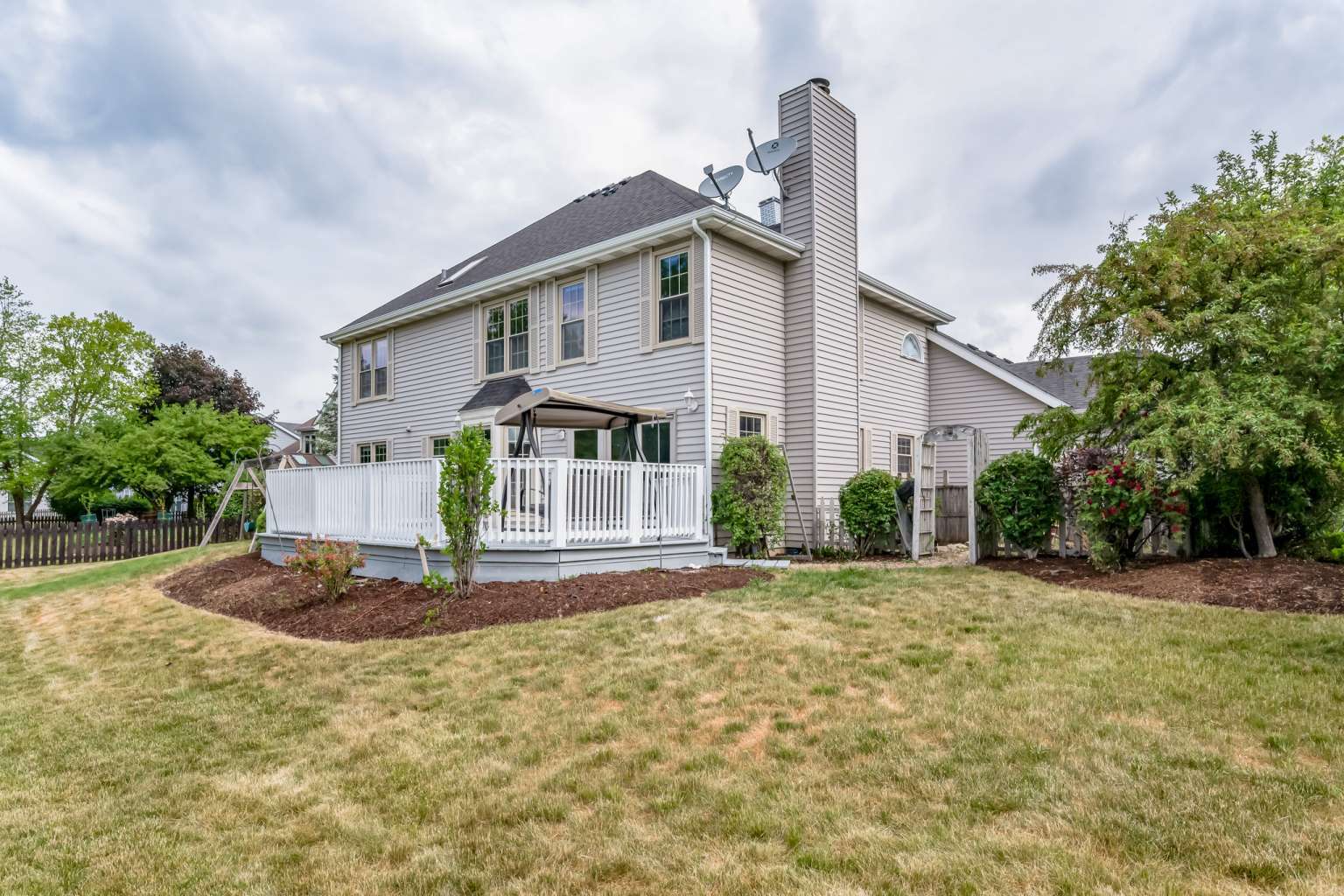 1113 Stonegate Court Bartlett, IL 60103 - Photo 24 of 25 a front view of a house with a yard and garage