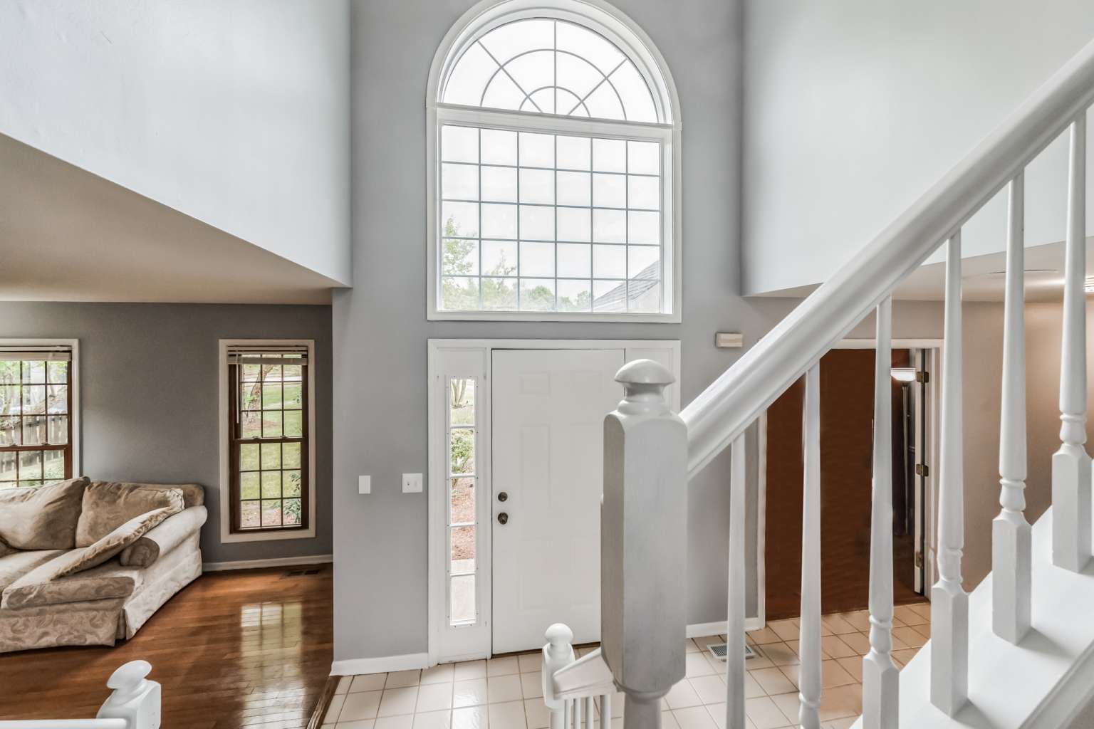 1113 Stonegate Court Bartlett, IL 60103 - Photo 3 of 25 a view of an entryway with wooden floor and windows