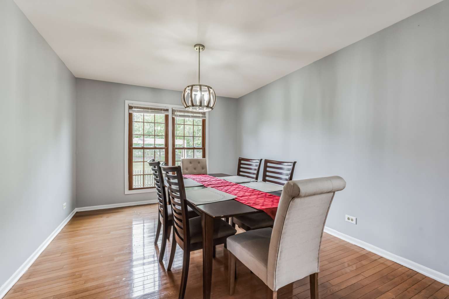 1113 Stonegate Court Bartlett, IL 60103 - Photo 6 of 25 a view of a dining room with furniture window and wooden floor