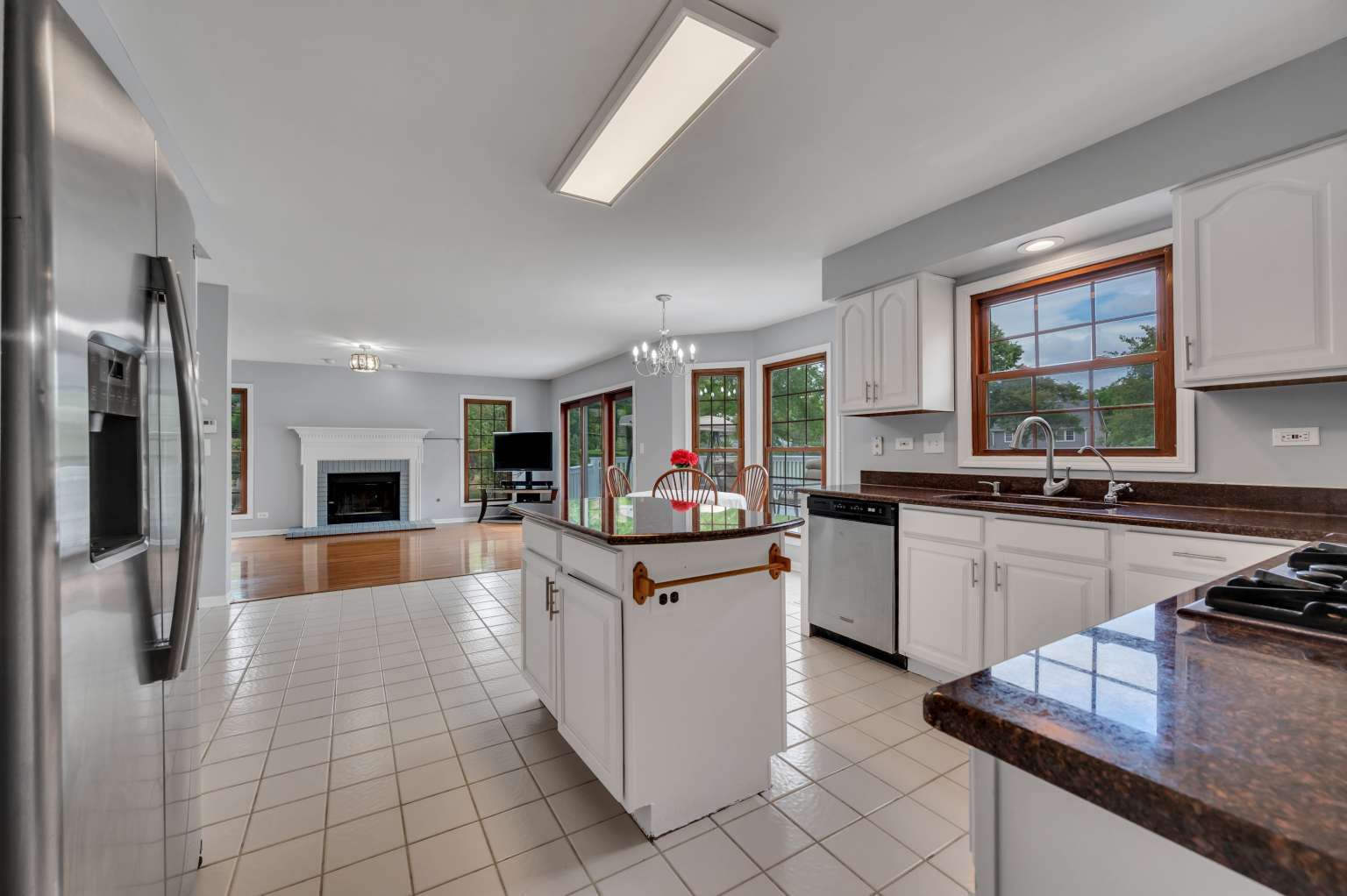 1113 Stonegate Court Bartlett, IL 60103 - Photo 7 of 25 a kitchen with stainless steel appliances granite countertop a refrigerator oven a sink dishwasher and white cabinets with wooden floor