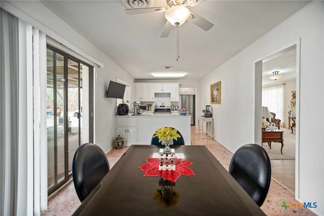 207 Williams Street Tivoli, TX 77990 - Photo 25 of 32 a living room with furniture and a chandelier