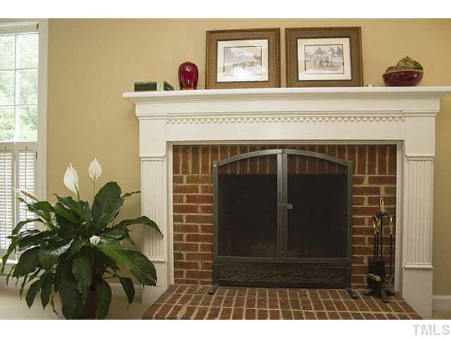 21 Swallows Ridge Court Durham, NC 27713 - Photo 6 of 25 a living room with furniture and a fireplace