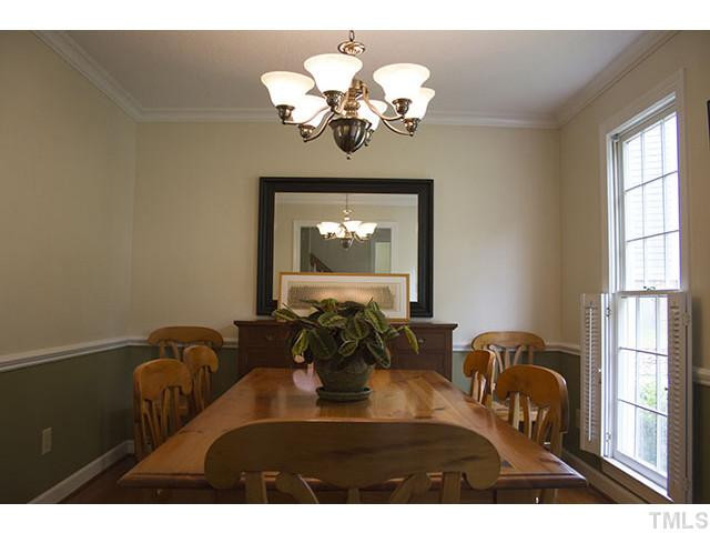 21 Swallows Ridge Court Durham, NC 27713 - Photo 8 of 25 a view of a dining room with furniture and chandelier