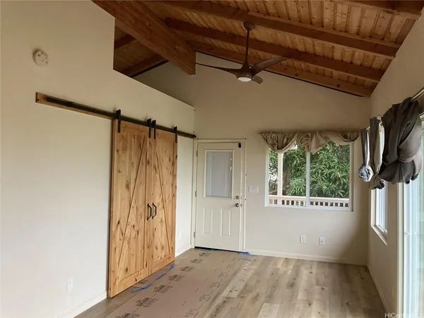 a view of an empty room with a window