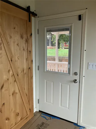 a view of front door with wooden floor