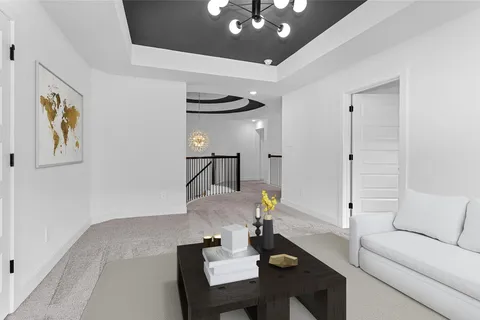 a living room with furniture and a chandelier