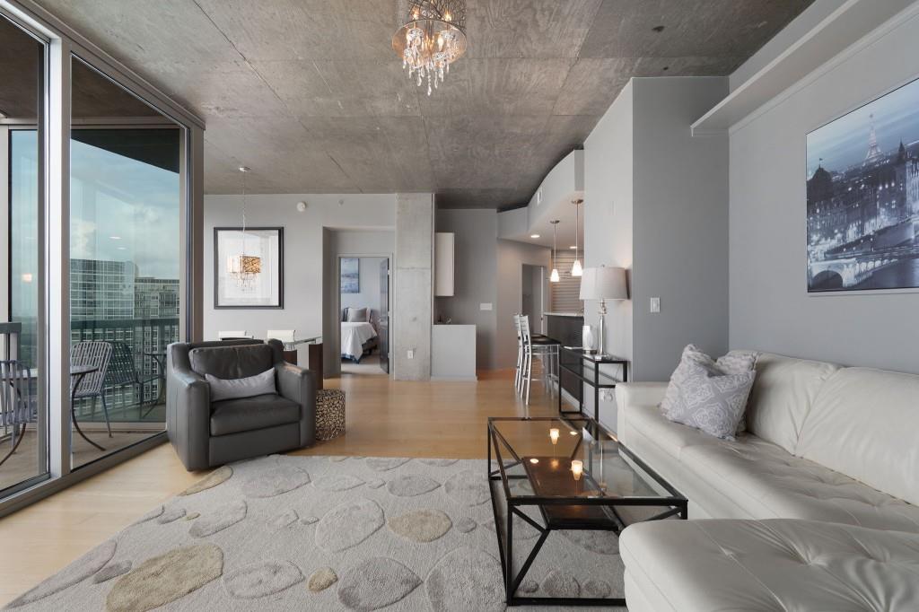 3324 Peachtree Road Northeast, Unit 2918 Atlanta, GA 30326 - Photo 11 of 27 a living room with furniture and a chandelier