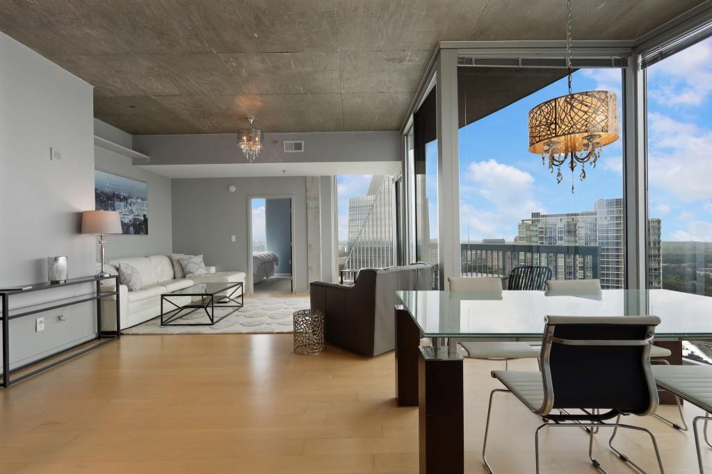 3324 Peachtree Road Northeast, Unit 2918 Atlanta, GA 30326 - Photo 8 of 27 a living room with furniture and a flat screen tv