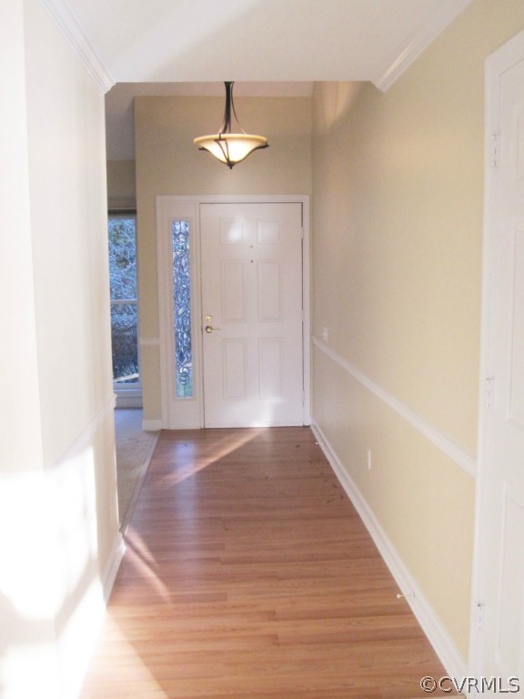 2913 Cove Ridge Trace Midlothian, VA 23112 - Photo 2 of 24 a view of an empty room with wooden floor and a window