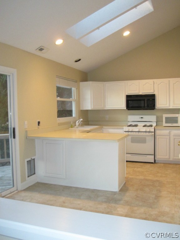 2913 Cove Ridge Trace Midlothian, VA 23112 - Photo 7 of 24 a view of kitchen with microwave cabinets and refrigerator