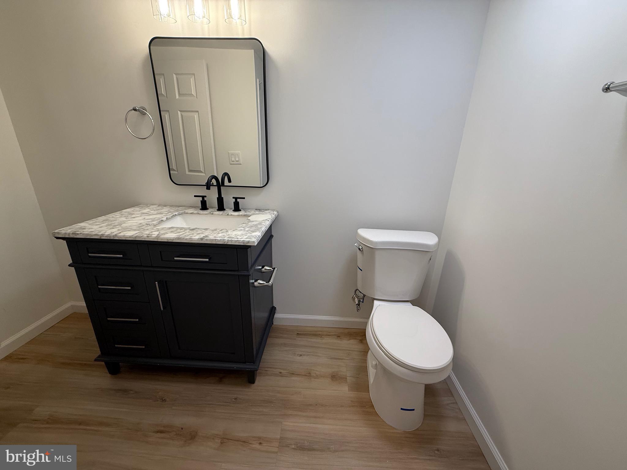 65 Springhill Road Mantua, NJ 08051 - Photo 4 of 10 a bathroom with a toilet a sink and mirror