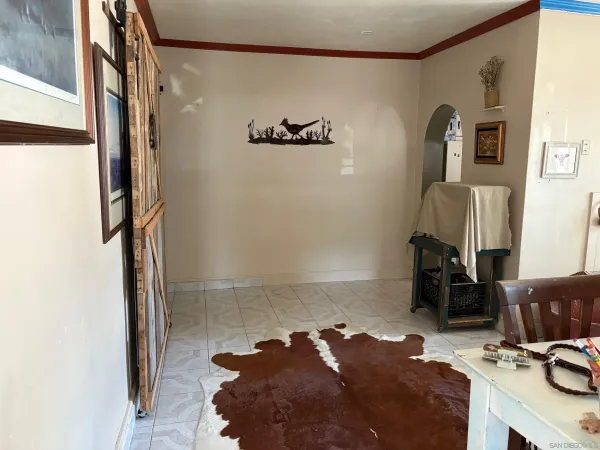 a bed room with a bed and a mirror