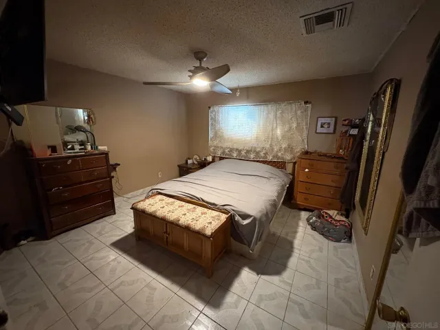 a bathroom with a sink vanity and mirror