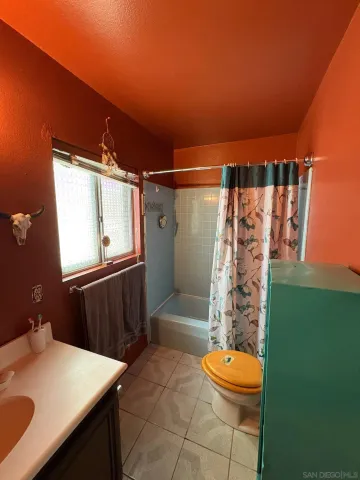 a view of an empty room with a furniture