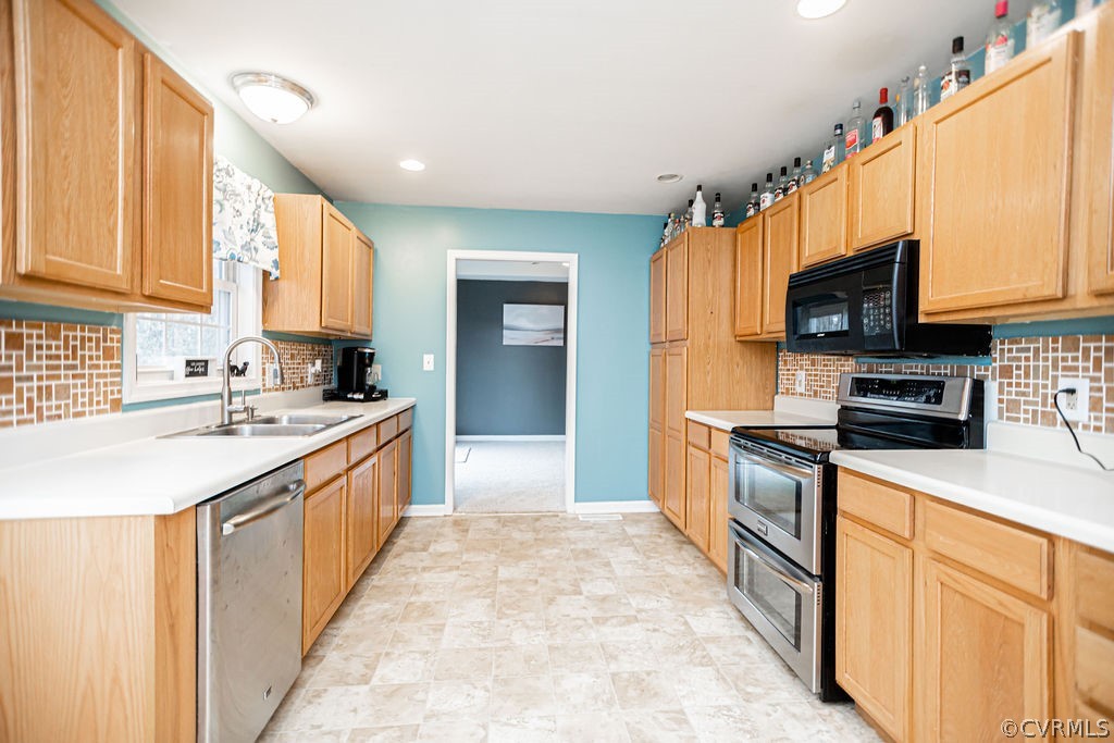 1595 Scuffletown Road Rice, VA 23966 - Photo 16 of 49 a kitchen with stainless steel appliances granite countertop a stove a sink and a microwave
