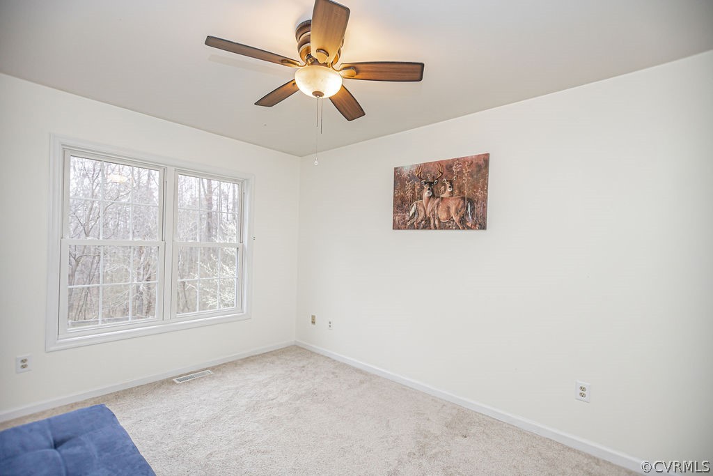 1595 Scuffletown Road Rice, VA 23966 - Photo 21 of 49 an empty room with a window and a fan